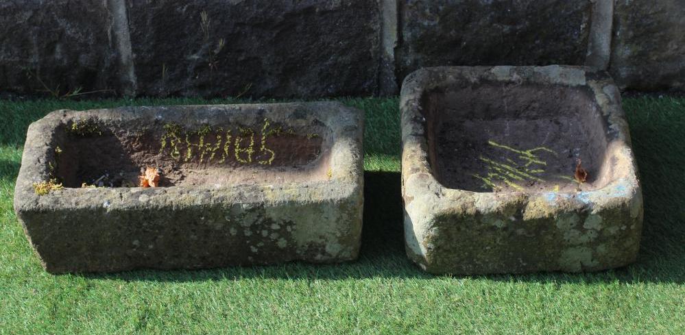 A SANDSTONE AMMONITE, 15" x 13", together with two small sandstone oblong troughs, 11" and 15" wide Image