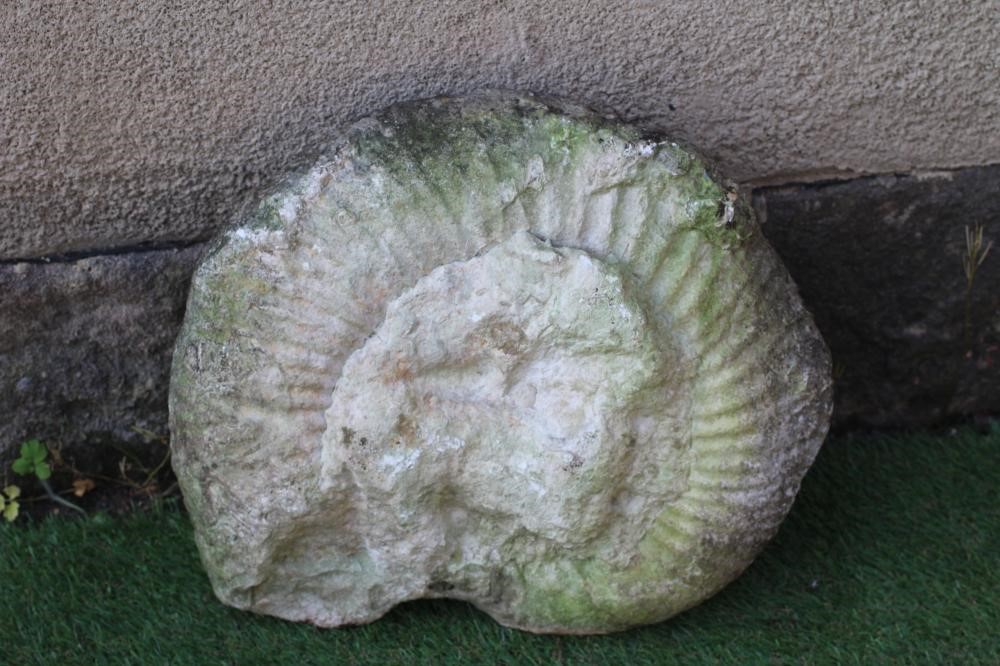 A SANDSTONE AMMONITE, 15" x 13", together with two small sandstone oblong troughs, 11" and 15" wide Image