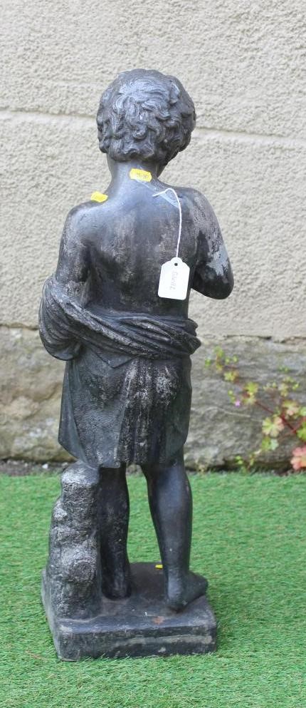 A VICTORIAN LEAD FIGURE OF A PUTTO modelled standing and holding a bird's nest, on square base, 7 Image