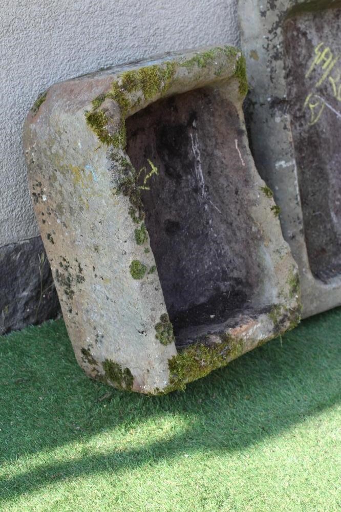 A SANDSTONE TROUGH of rough hewn oblong form, 23 1/2 x 16 1/2 x 10", together with a sandstone sink, Image