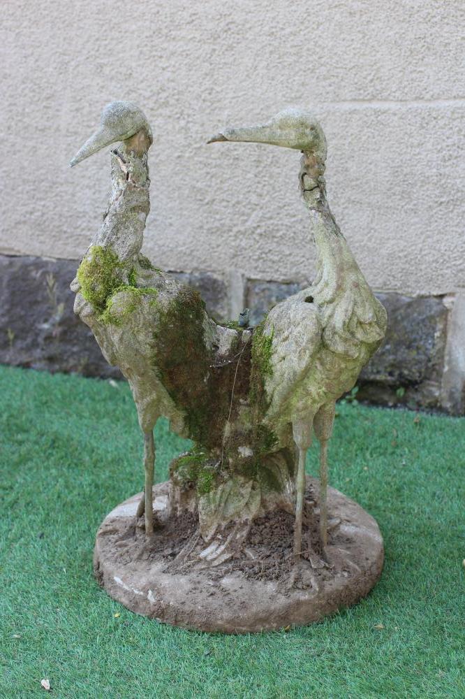 A CAST IRON FOUNTAIN, modelled as a pair of herons amongst foliage issuing a water spout, on Image