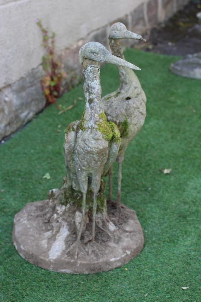 A CAST IRON FOUNTAIN, modelled as a pair of herons amongst foliage issuing a water spout, on Image