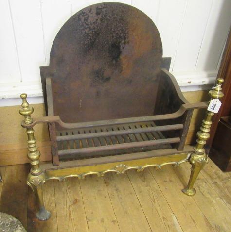 A BAROQUE STYLE CAST IRON AND BRASS FIRE BASKET Image
