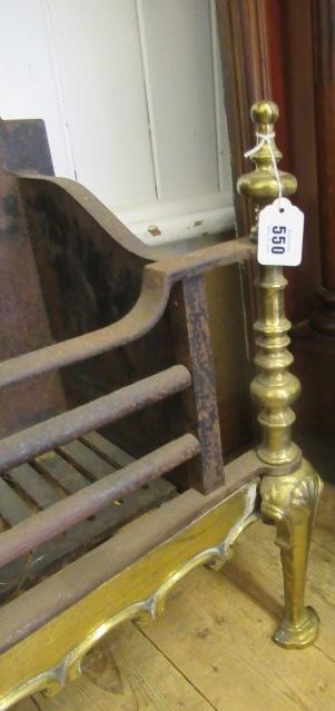 A BAROQUE STYLE CAST IRON AND BRASS FIRE BASKET Image