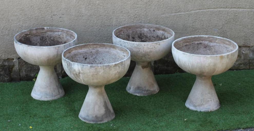 A SET OF FOUR COMPOSITION GOBLET SHAPED PLANTERS Image