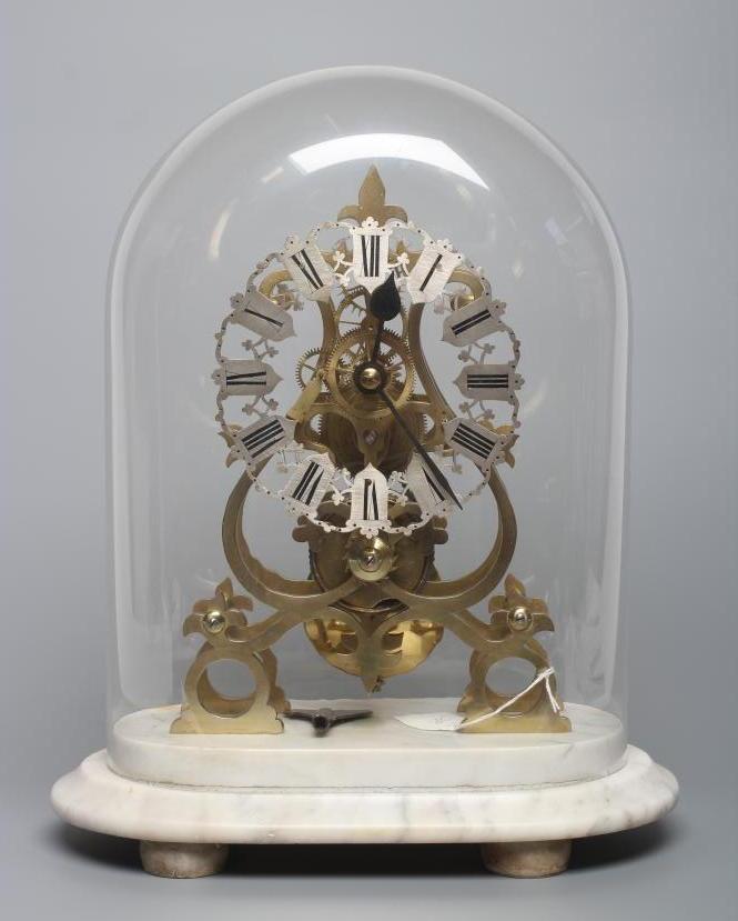 A BRASS SKELETON TIMEPIECE Image