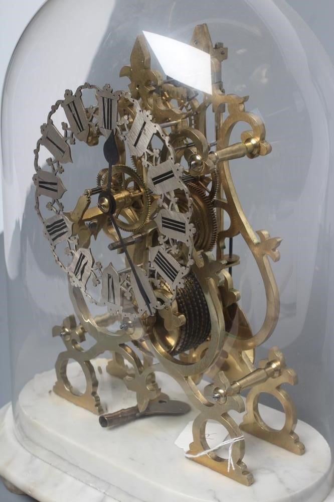 A BRASS SKELETON TIMEPIECE Image