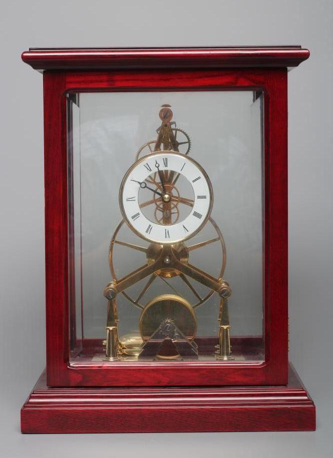 A BRASS SKELETON TIMEPIECE Image