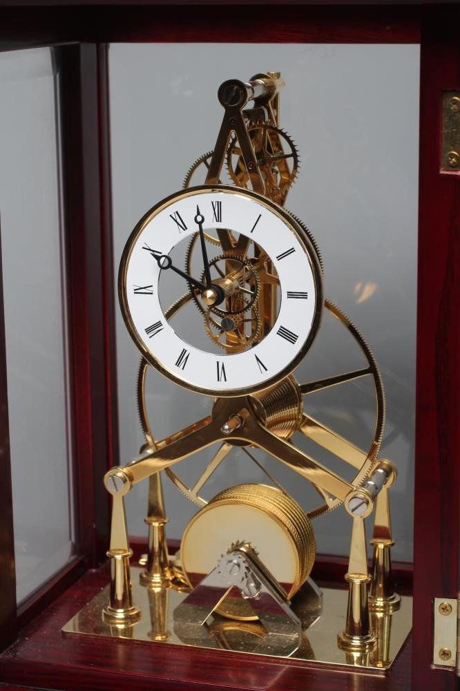 A BRASS SKELETON TIMEPIECE Image