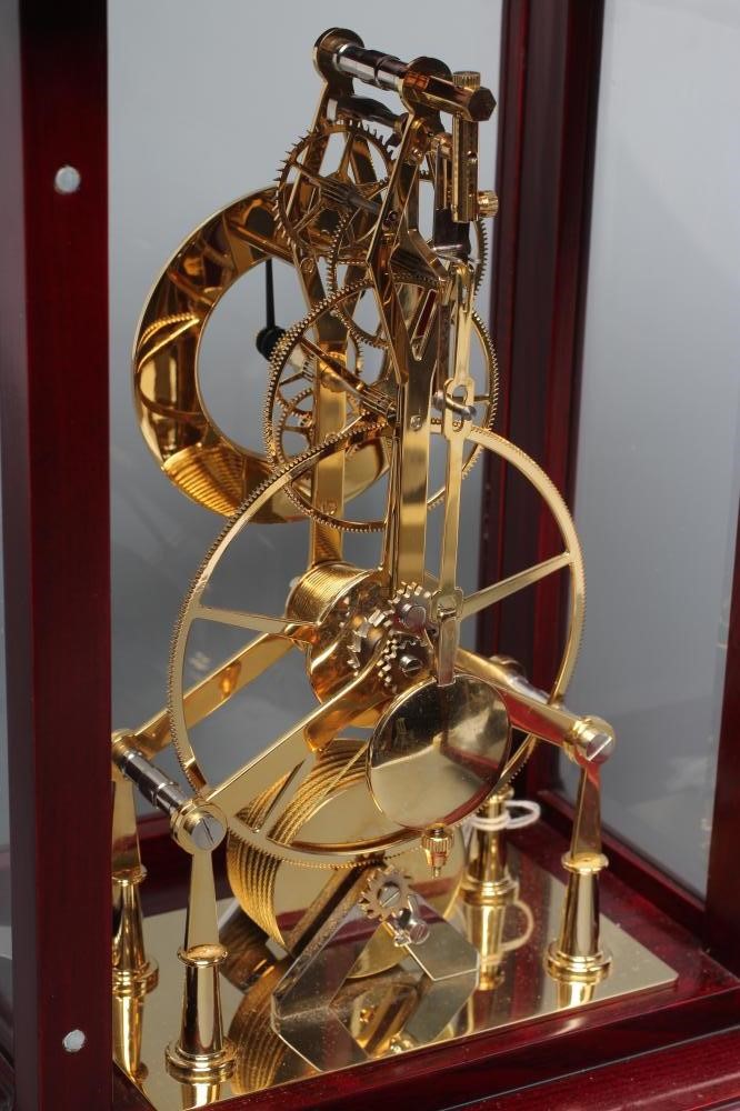 A BRASS SKELETON TIMEPIECE Image