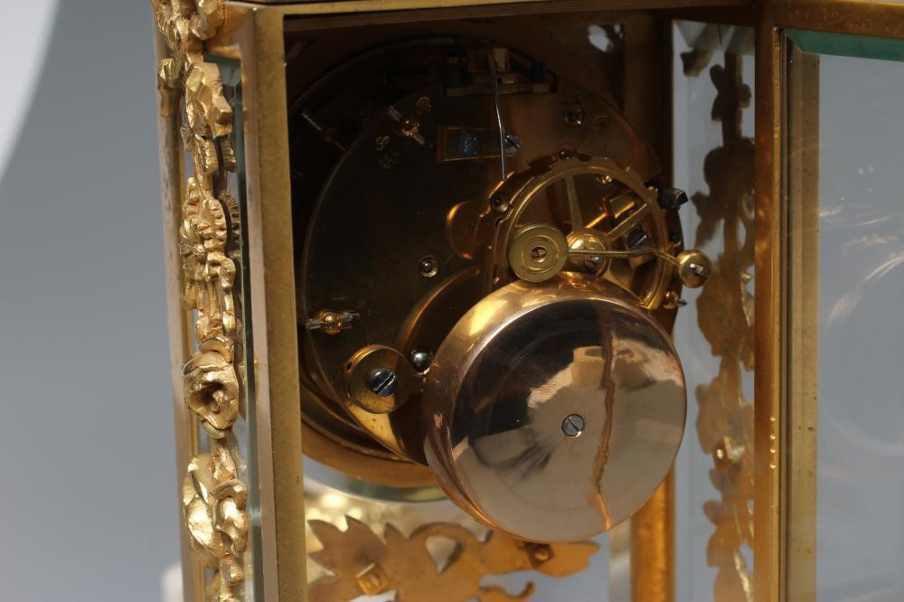 A GILT METAL AND ALABASTER CLOCK GARNITURE Image