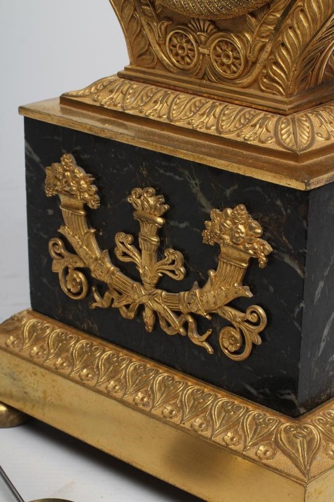 A LOUIS XVI STYLE GILT METAL LYRE MANTEL CLOCK Image