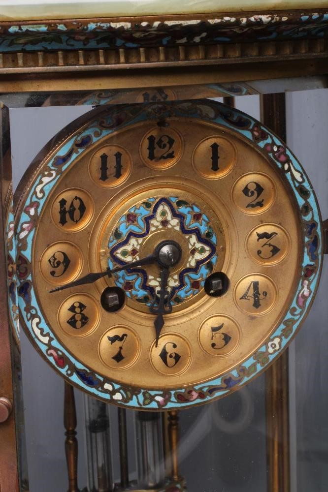 A FRENCH GREEN ONYX AND CHAMPLEVE ENAMEL FOUR GLASS MANTEL CLOCK Image