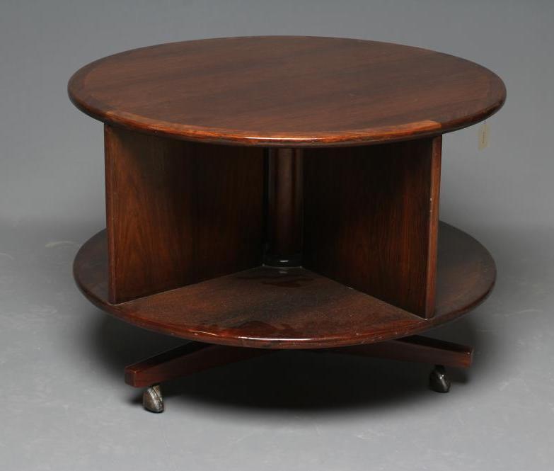 A ROSEWOOD REVOLVING BOOKCASE, mid 20th century, of two tier circular form with turned central Image