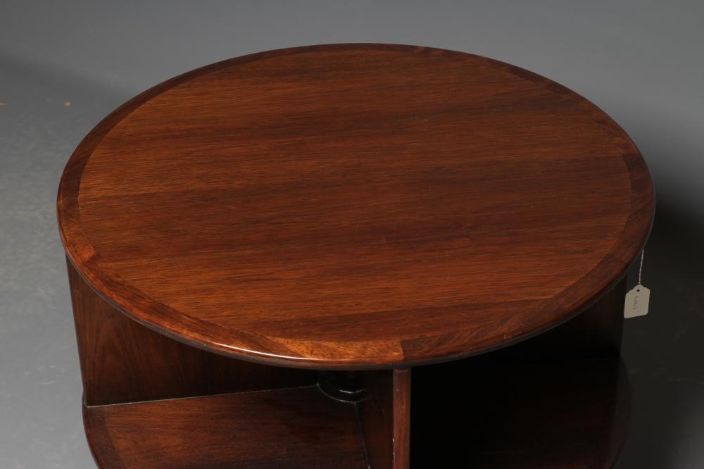 A ROSEWOOD REVOLVING BOOKCASE, mid 20th century, of two tier circular form with turned central Image