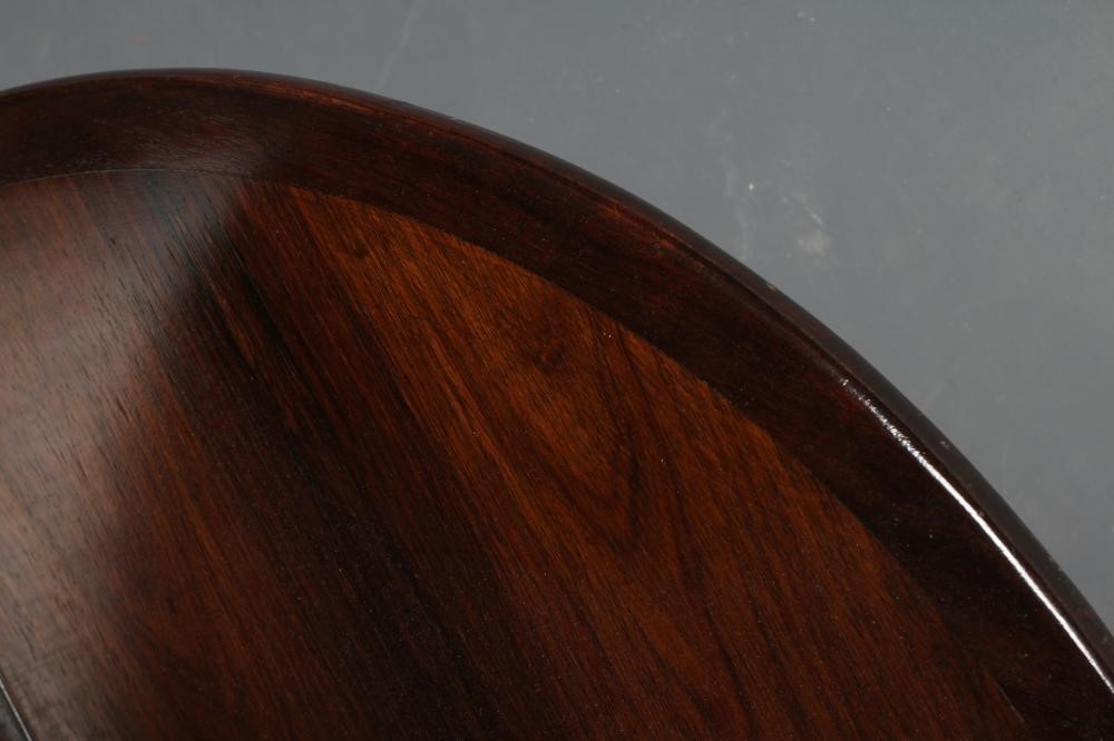 A ROSEWOOD REVOLVING BOOKCASE, mid 20th century, of two tier circular form with turned central Image