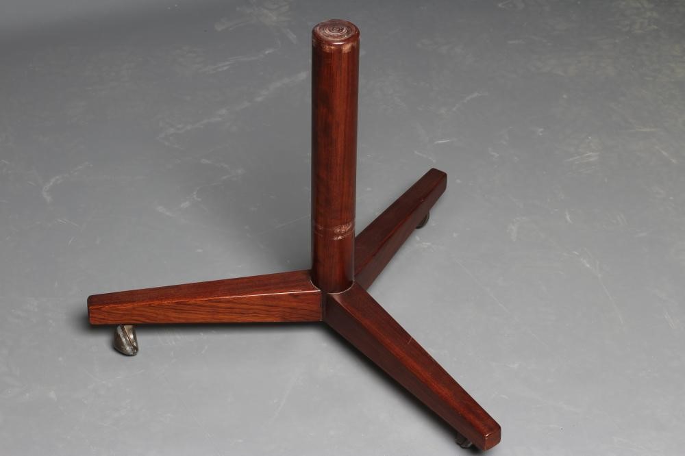 A ROSEWOOD REVOLVING BOOKCASE, mid 20th century, of two tier circular form with turned central Image