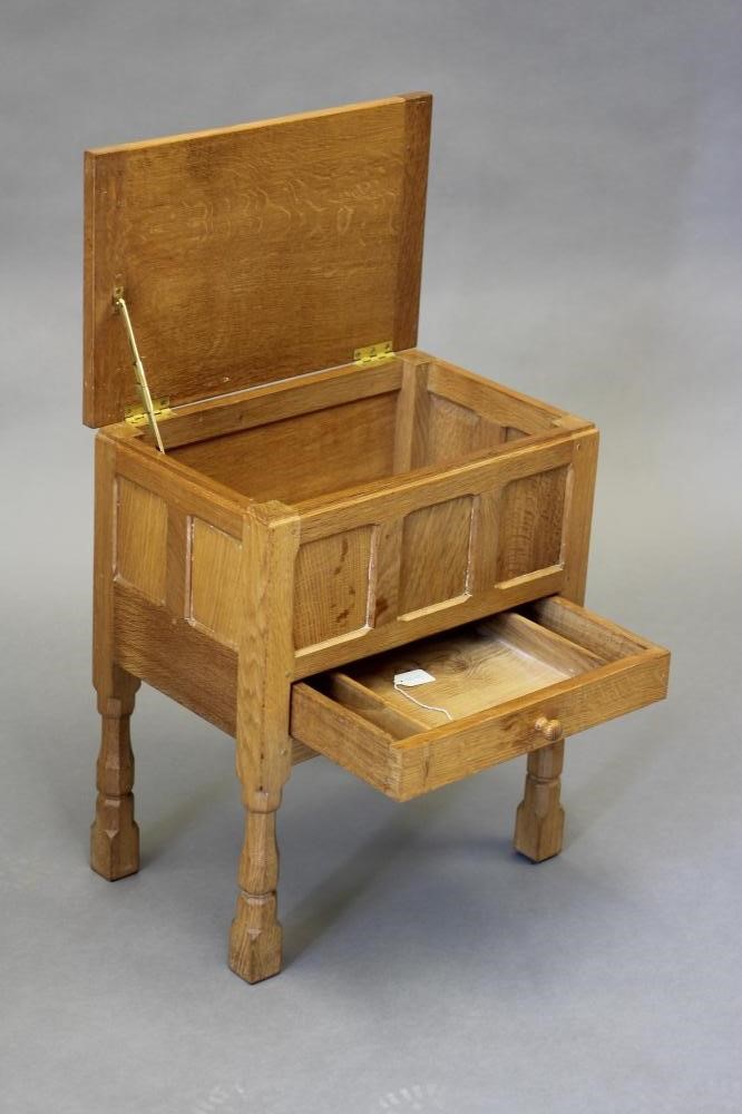 A ROBERT THOMPSON ADZED OAK WORKBOX of oblong panelled form Image