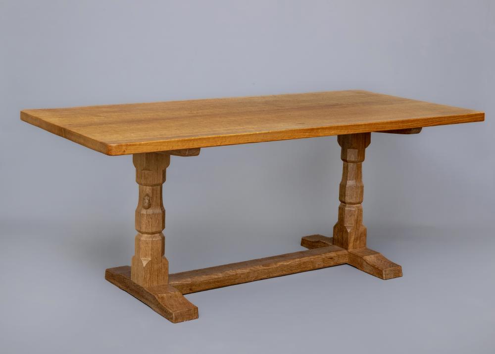 A ROBERT THOMPSON ADZED OAK DINING TABLE Image