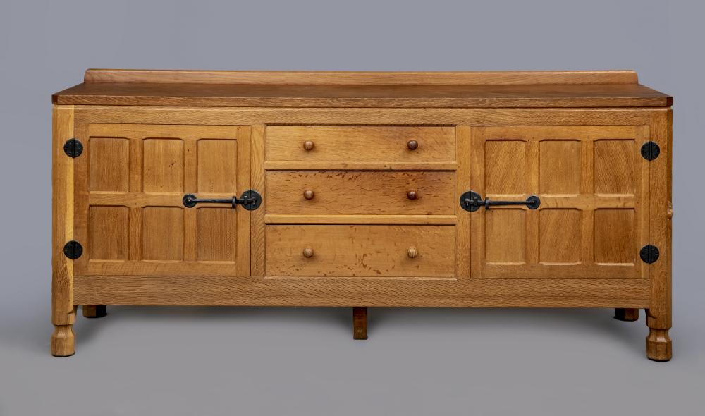 A ROBERT THOMPSON ADZED OAK ENCLOSED DRESSER Image