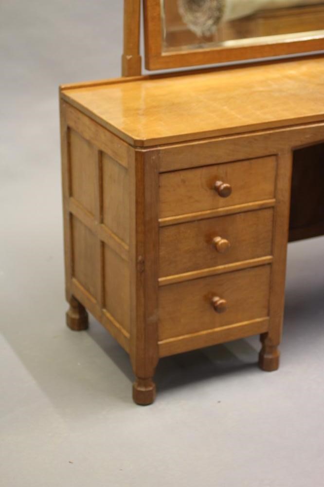 A ROBERT THOMPSON ADZED OAK DRESSING TABLE Image