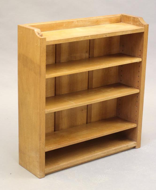 A ROBERT THOMPSON ADZED OAK OPEN BOOKCASE of oblong form with three quarter galleried top Image