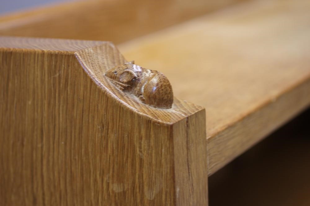 A ROBERT THOMPSON ADZED OAK OPEN BOOKCASE of oblong form with three quarter galleried top Image