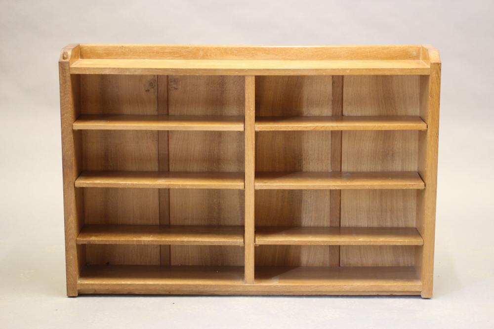A ROBERT THOMPSON ADZED OAK OPEN BOOKCASE of oblong form with three quarter galleried top Image