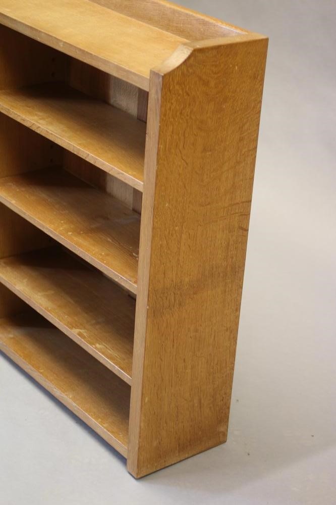 A ROBERT THOMPSON ADZED OAK OPEN BOOKCASE of oblong form with three quarter galleried top Image