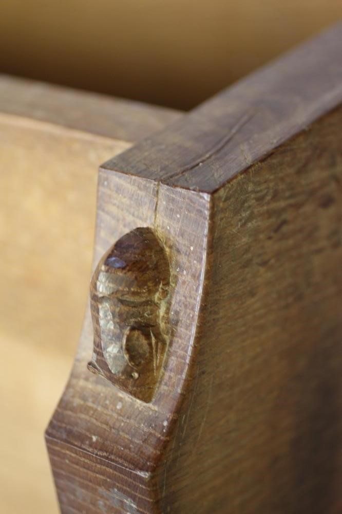 A ROBERT THOMPSON ADZED OAK OPEN BOOKCASE of oblong form with three quarter galleried top Image