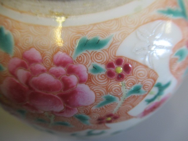 A CHINESE PORCELAIN FAMILLE ROSE JAR of ovoid form painted with roundels of peonies on a scattered Image