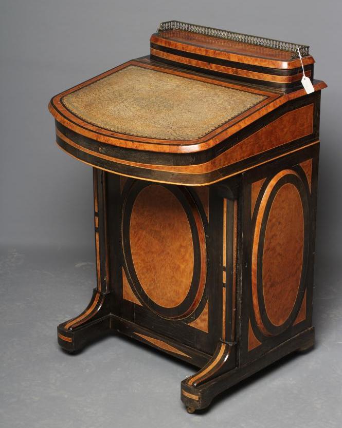 A VICTORIAN YEW AND EBONISED DAVENPORT Image