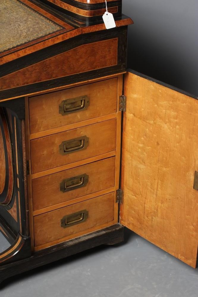 A VICTORIAN YEW AND EBONISED DAVENPORT Image