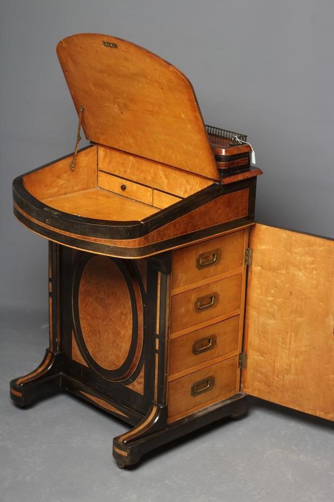 A VICTORIAN YEW AND EBONISED DAVENPORT Image