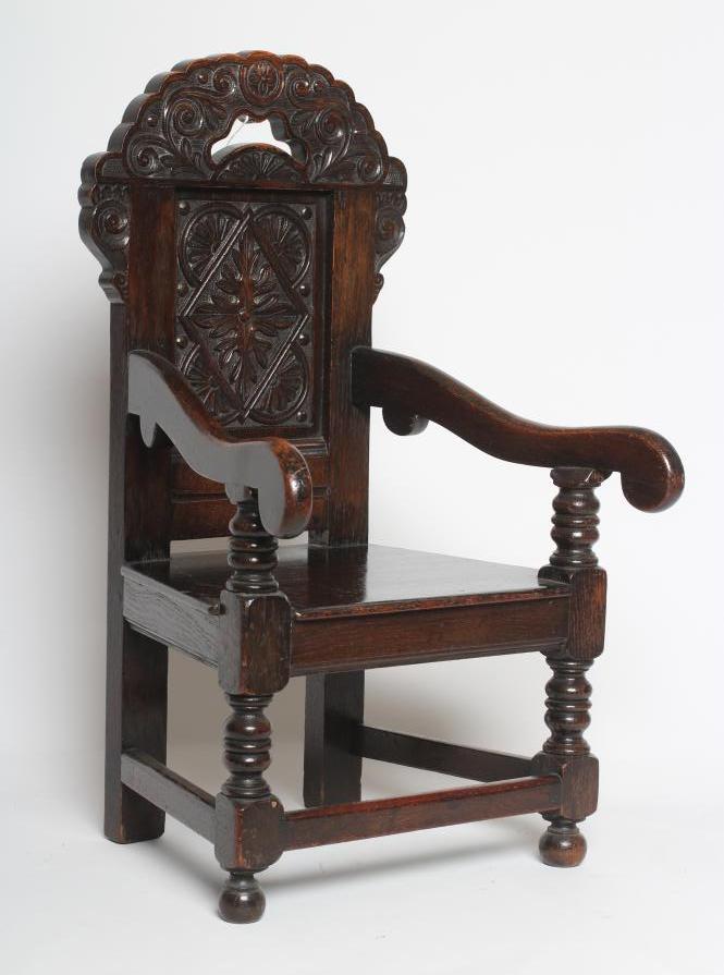 A CHILDS JOINED OAK ARMCHAIR Image