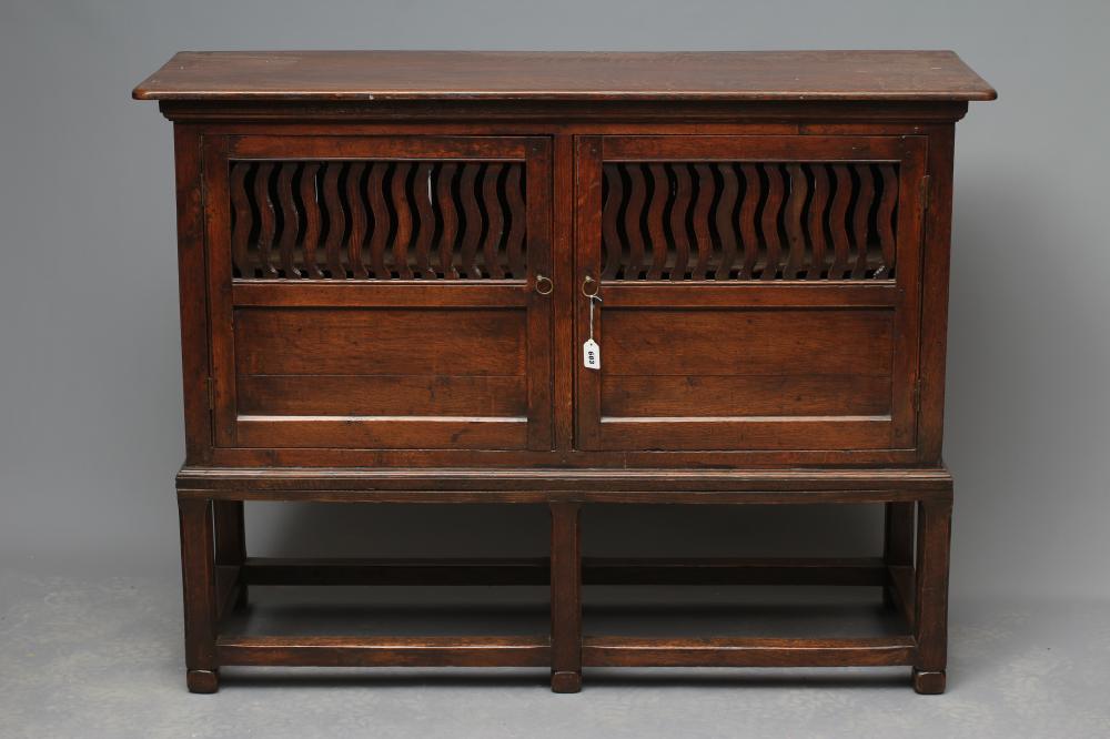 A JOINED OAK LIVERY CUPBOARD Image