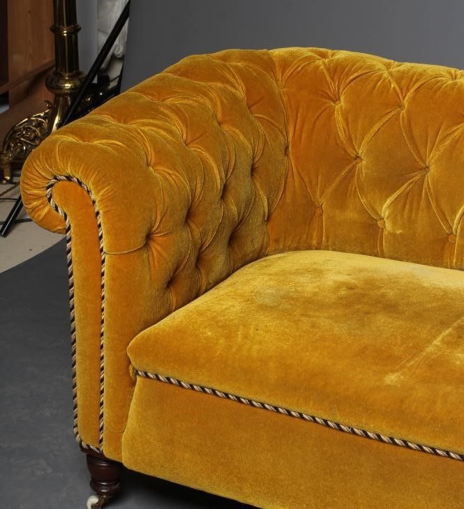 A VICTORIAN WALNUT FRAMED CHESTERFIELD DROP END SETTEE button upholstered in mustard yellow Image
