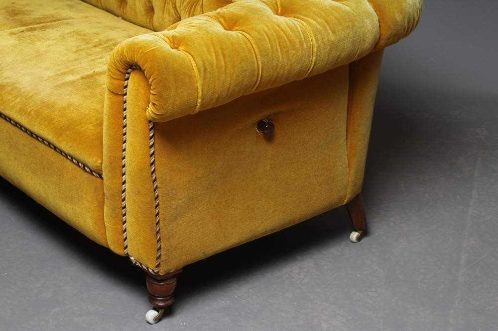 A VICTORIAN WALNUT FRAMED CHESTERFIELD DROP END SETTEE button upholstered in mustard yellow Image