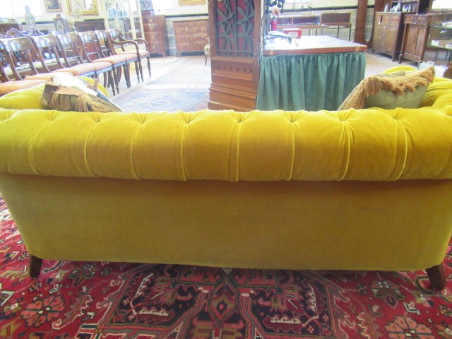 A VICTORIAN WALNUT FRAMED CHESTERFIELD DROP END SETTEE button upholstered in mustard yellow Image