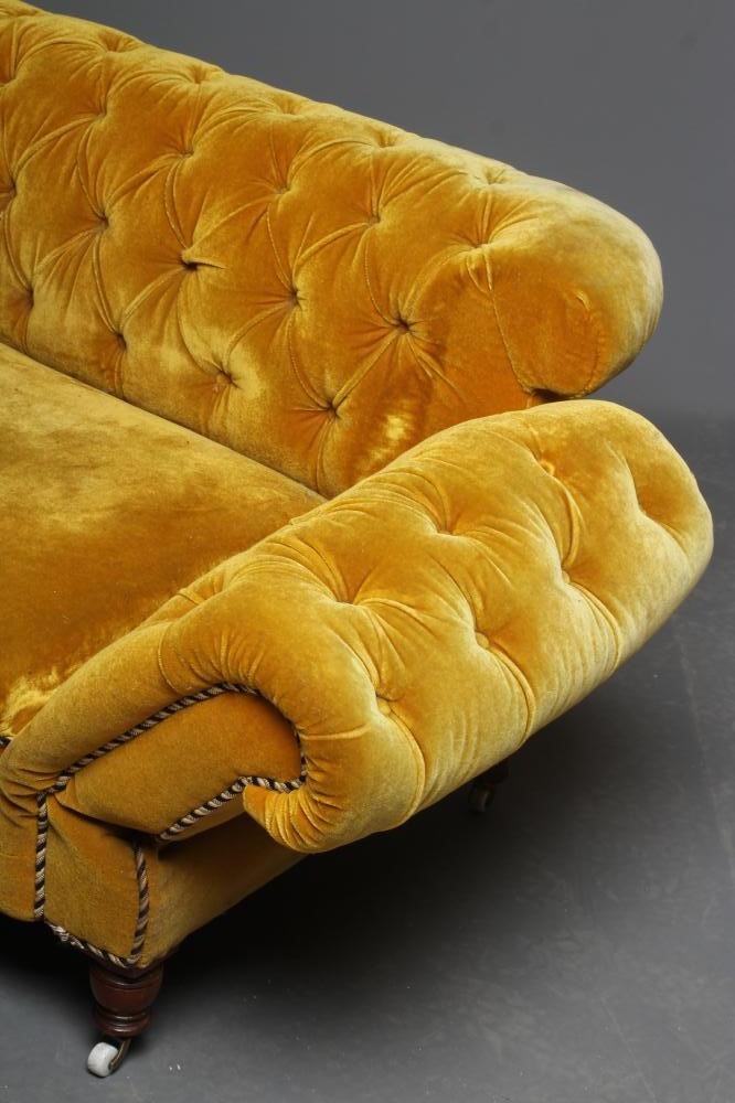 A VICTORIAN WALNUT FRAMED CHESTERFIELD DROP END SETTEE button upholstered in mustard yellow Image