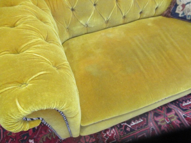 A VICTORIAN WALNUT FRAMED CHESTERFIELD DROP END SETTEE button upholstered in mustard yellow Image