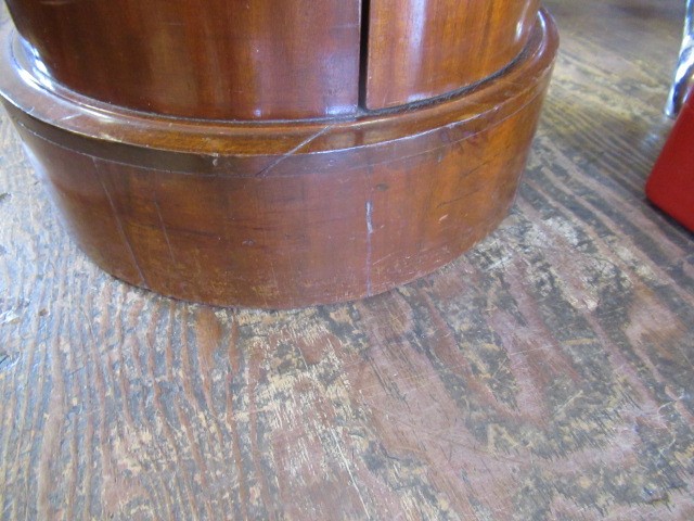 A PAIR OF VICTORIAN MAHOGANY BEDSIDE CABINETS of cylindrical form with inset veined white marble top Image