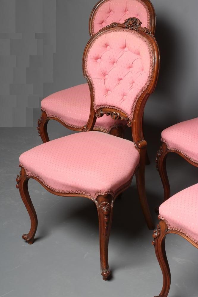 A SET OF FOUR VICTORIAN WALNUT BALLOON BACK SALON CHAIRS button upholstered in a pink weave Image