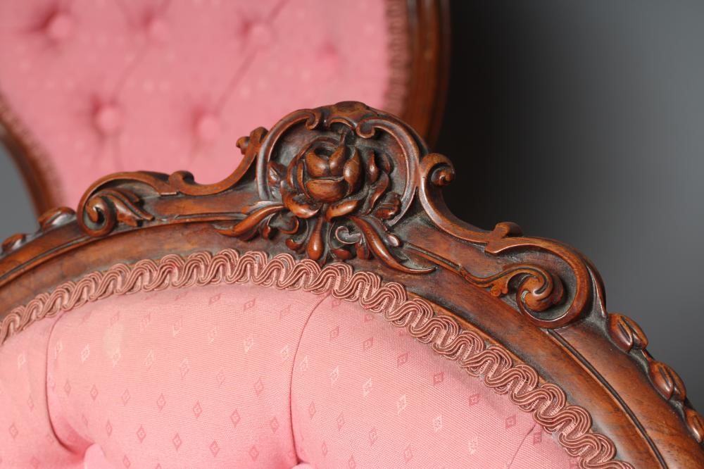 A SET OF FOUR VICTORIAN WALNUT BALLOON BACK SALON CHAIRS button upholstered in a pink weave Image