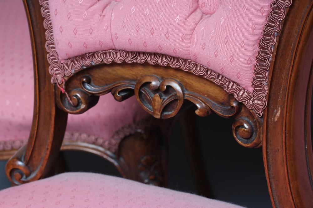A SET OF FOUR VICTORIAN WALNUT BALLOON BACK SALON CHAIRS button upholstered in a pink weave Image