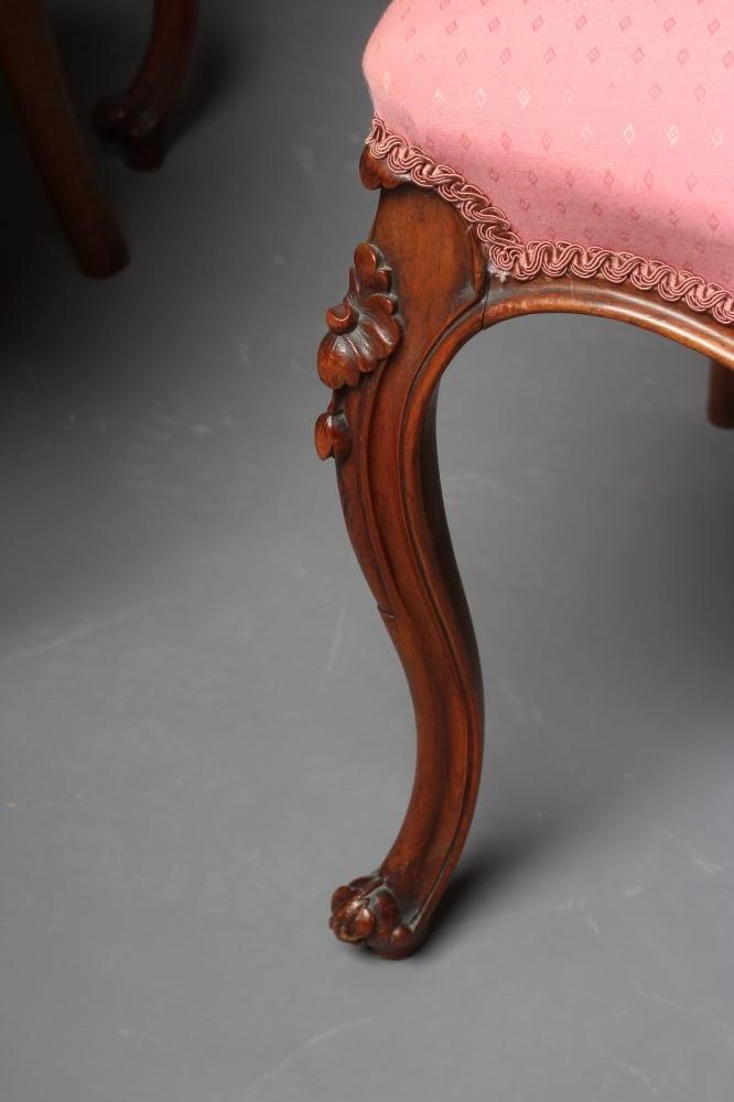 A SET OF FOUR VICTORIAN WALNUT BALLOON BACK SALON CHAIRS button upholstered in a pink weave Image