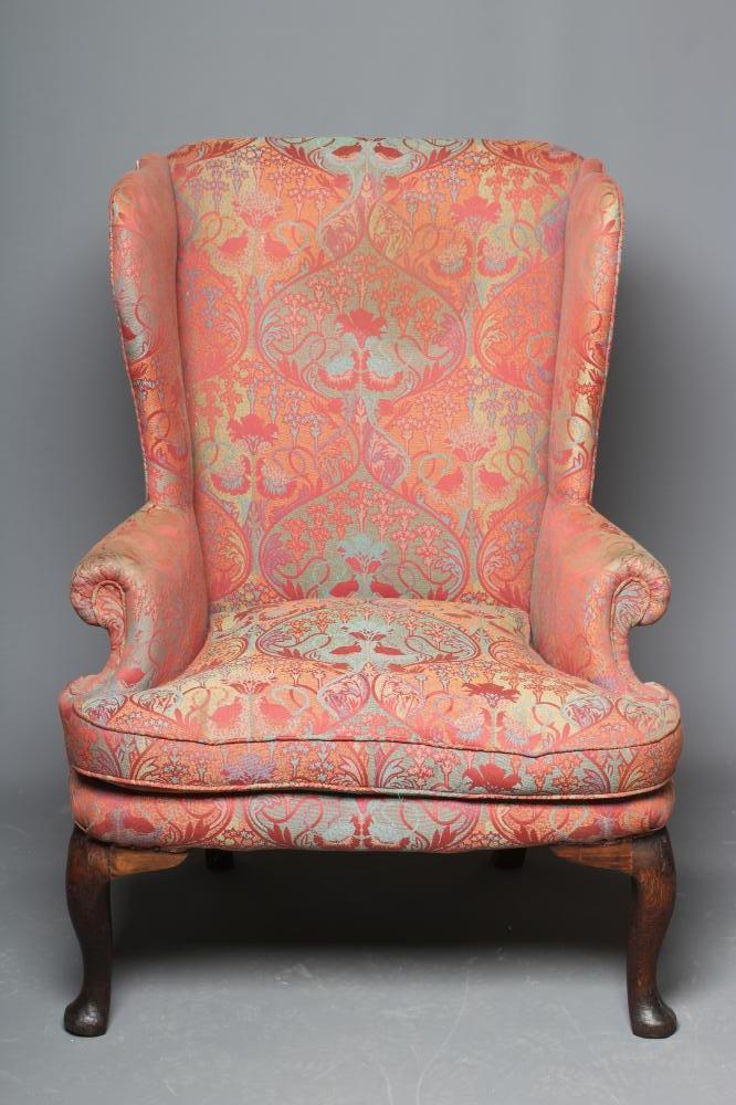 A GEORGIAN OAK FRAMED WING ARMCHAIR Image