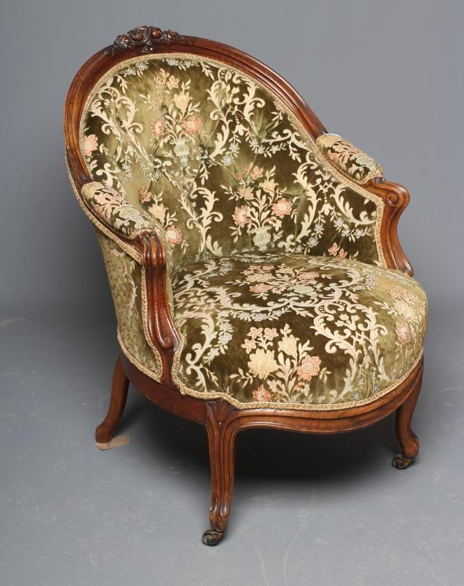 A VICTORIAN WALNUT SHOW FRAME NURSING CHAIR button upholstered in green cut velvet Image