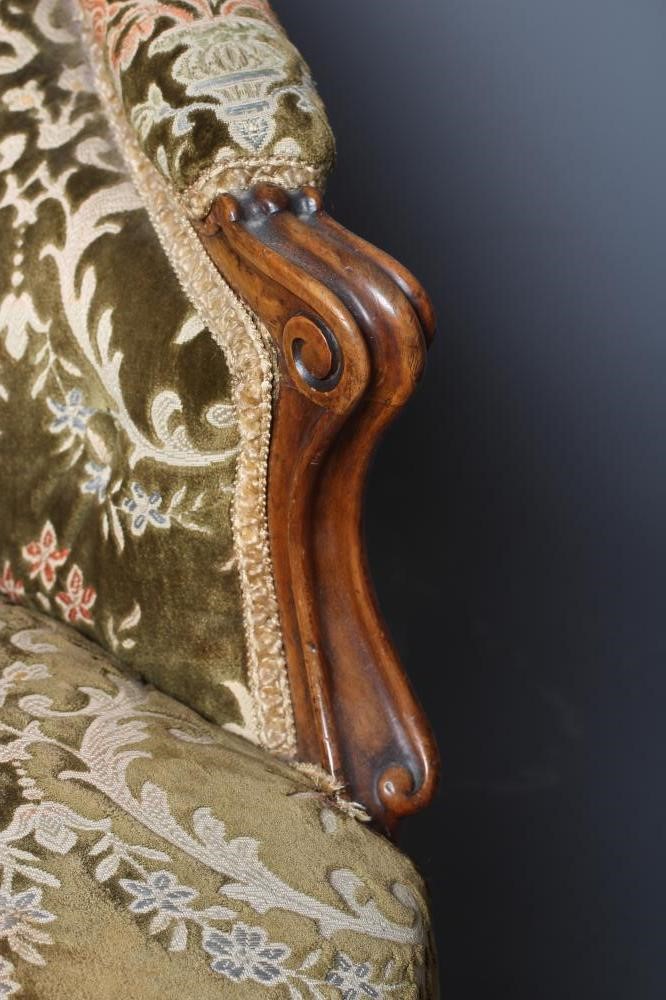 A VICTORIAN WALNUT SHOW FRAME NURSING CHAIR button upholstered in green cut velvet Image