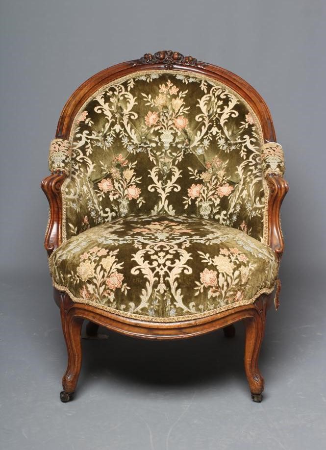 A VICTORIAN WALNUT SHOW FRAME NURSING CHAIR button upholstered in green cut velvet Image